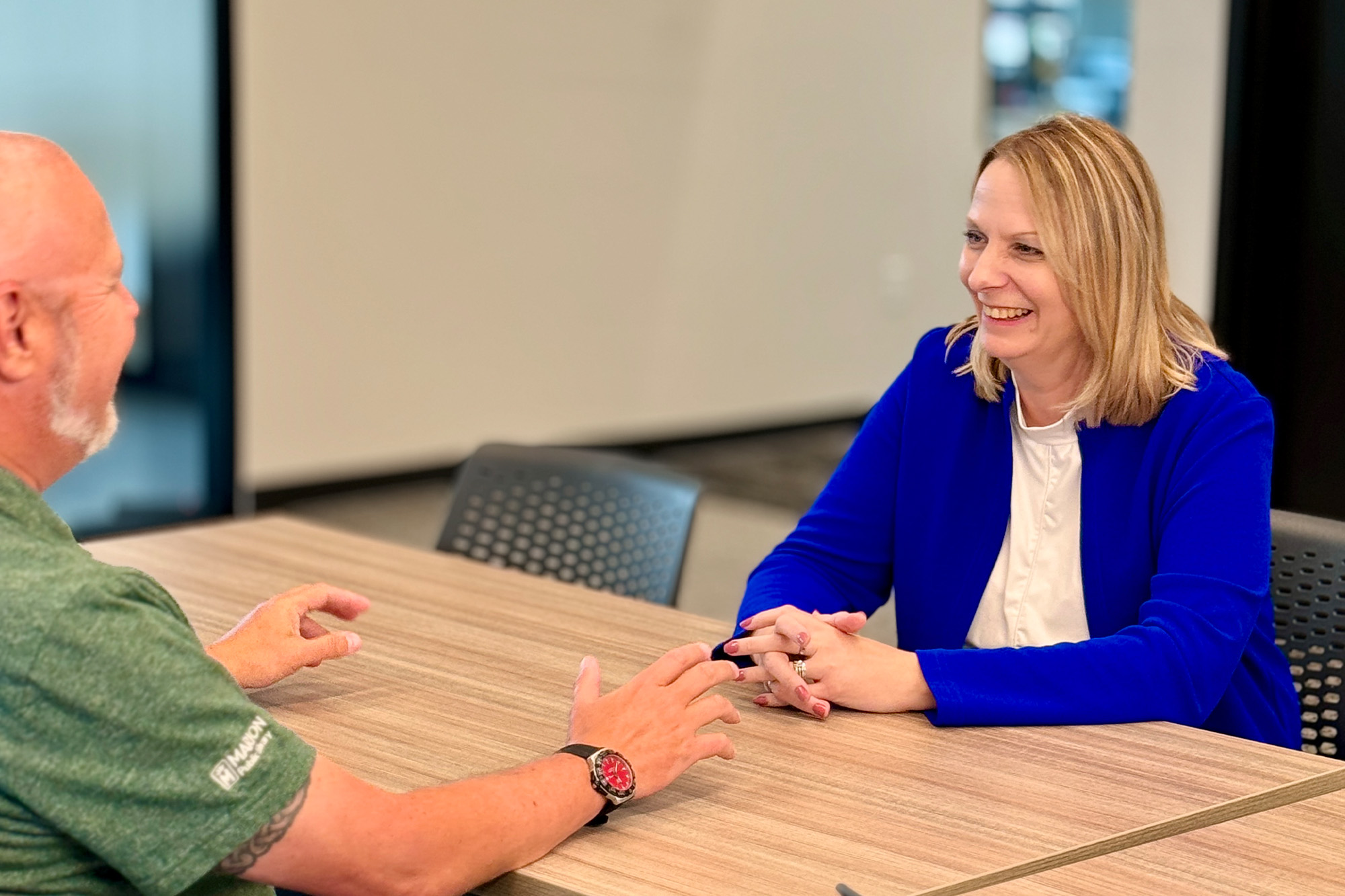 Melissa Pence sitting across the table from a client