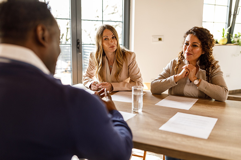 business people sitting around table