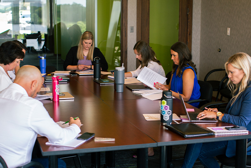amperage team members meeting in board room
