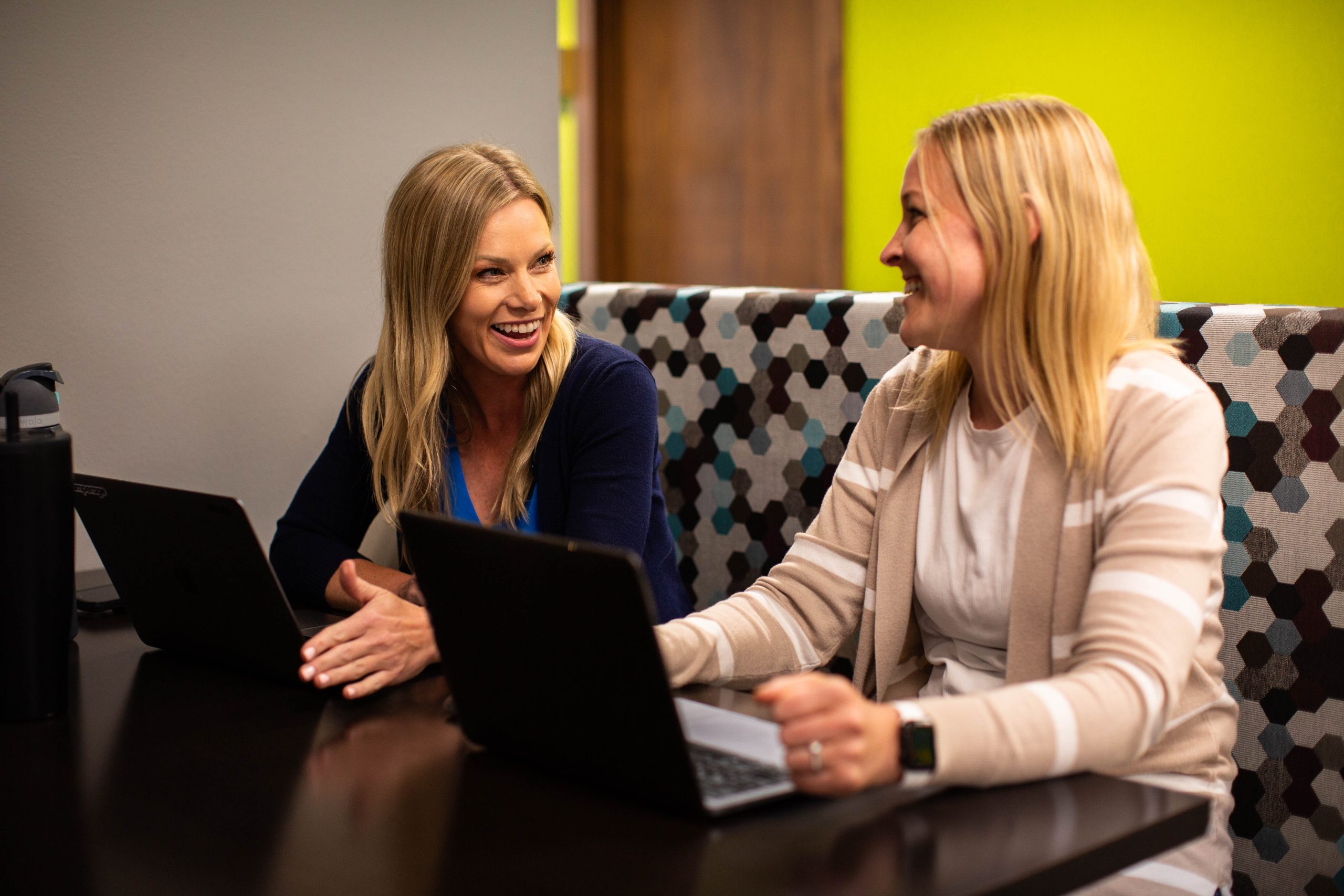 Rachael and Kaitlyn talking at table