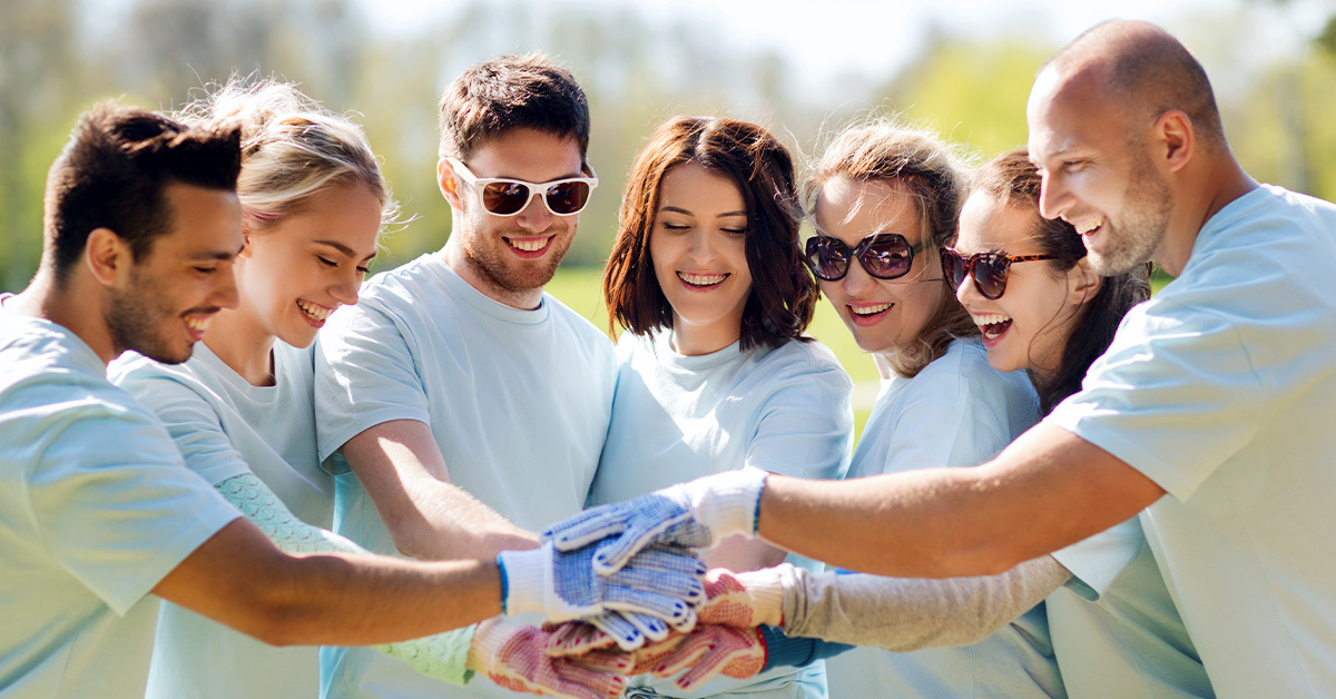 Group of volunteers working together demonstrating Corporate Social Responsibility (CSR).